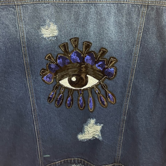 New oversized unisex jean jacket size med. Distressed with evil eye on back - Picture 1 of 3